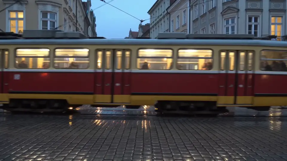 Tram passing over glossy cobblestones, fixed camera, Seedance 2.0 Fast