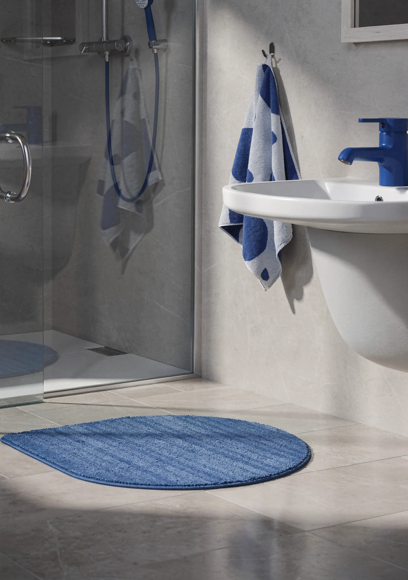 A bathroom put together from four product photos: bathtub, basin, mirror and accessories